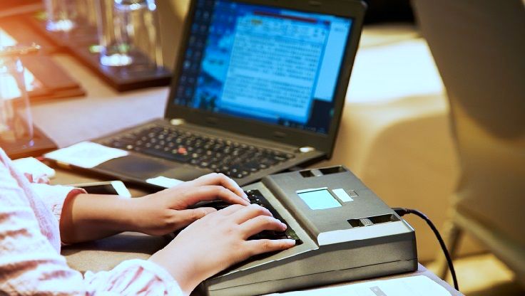 a CART writer with a stenograph